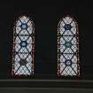 Interior. 
Detail of stained glass in the aisle at ground level.