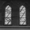 Interior. 
Detail of stained glass in the aisle at ground level.