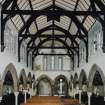 Interior. 
General view of upper level from W showing the inserted floor, the arcade and the roof structure.