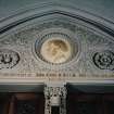 Interior. W lobby, detail of tympanum with portrait  medallion of Rev John Eadie by John Mossman 1876