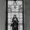 Interior. N wall  stained glass window c.1929 memorial to Rev John Wilson