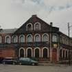 View from E of E side (left, Elliot Street) amd NE side (right, Houldsworth Street) of building