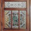 Glasgow, 56 Langside Drive, interior.
General view of  ground floor reception room, door to hall. Detail of stained glass panel.