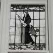 Glasgow, 54 Langside Drive, interior.
General view of ground floor music room, stained glass window. A lady in medieval dress with a lute.