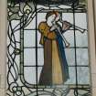 Glasgow, 54 Langside Drive, interior.
General view of ground floor music room stained glass window, a design of two ladies in medieval dress playing hautbois.
