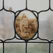Glasgow, 54 Langside Drive, interior.
Detail of roundel in the stained glass window on the first floor landing. A design of a picturesque street scene with a building with a balcony.