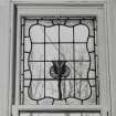 Glasgow, 54 Langside Drive, interior.
Detail of small stained glass window to East on the first floor landing. A design of a central tulip-like flower.