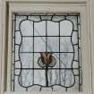 Glasgow, 54 Langside Drive, interior,
Detail of stained glass window on first floor landing. A design with a tulip-like flower.