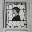 Glasgow, 54 Langside Drive, interior.
Detail of the the stained glass window in the East room on the first floor.A design of a lady in profile with bound hair.