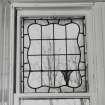 Glasgow, 54 Langside Drive, interior.
Detail of the stained glass window in the East room on the first floor. A design with a tulip in the bottom right hand corner.