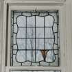 Glasgow, 54 Langside Drive, interior.
Detail of stained glass window in the East room on the first floor. A design with a tulip in the bottom right hand corner.