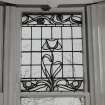 Glasgow, 52 Langside Drive, interior.
Detail of ground floor drawing room stained glass window panel. A design of stylized flowers.