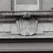 Janitor's house, carved cartouche style panel, detail