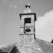 West wall, bellcote crowned by ball finial, detail