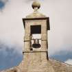 West wall, bellcote crowned by ball finial, detail