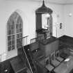 View of interior (towards ogee-canopied pulpit) from balcony