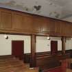 View of balcony and pews underneath balcony from South West