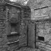 Detail of sacrament house, grave slab and two armorial panels in North East corner of church.