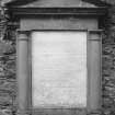 Detail of monument to Rev. James Reid set into inside of South wall.