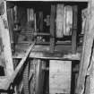 Detail of threshing machine in barn.