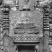 Detail of sacrament house: inscription and tegulated decoration.