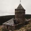 View from N, showing the central tower and wind vane, and its two adjacent 'pavilions'