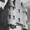 View of chimney gable and flanking rounds, S elevation.