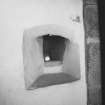 Interior.
Detail of shot-hole embrasure in SE compartment (larder), ground floor.