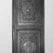 Interior.
Detail of carved panel set in embrassure sides of E window in hall.