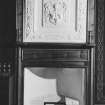 Interior.
View of plaster armorial panel above fireplace in SE compartment, fourth floor.