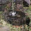 Detail of font collecting water below fountain