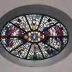 Interior. Detail of E wall oval stained glass window