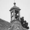 Birdcage bellcote, with clock and 1804 datestone