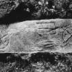 Detail of incised medieval grave-slab bearing two crosses, a pair of shears and an unidentified rectangular object.