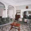 Interior.
View of first floor drawing room from W showing the ionic arcade and archway to the library.