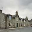 Exterior view from E of "colonies" Railway Workers' housing in Harlaw Rd, King St & Queen St
Photosurvey 17 August 1994