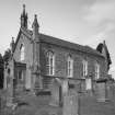 General view from SE showing church.