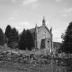 View from W showing church, churchyard and perimeter rubble wall.