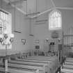 Interior.
View from SE showing pews, organ and communion table.