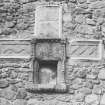 View of cruciform set in wall of sacrament house.