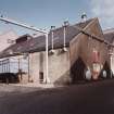 General view from SW of gable of Mash House, Tun Room, and Malt Store.