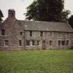 View of W wing of stable block from SW.