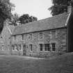 View of N wing of stable block from S.