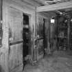 Interior.
View of basement of mill, showing gear cupboard, mostly obscured behind wooden panelling.