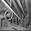 Interior.
Detailed interior view at attic level in the mill, showing a variety of belt-pulley drives.