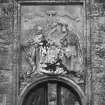 Detail of heraldic plaque above main entrance, E facade.