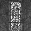 Detail of stained glass window in W wall of tower.