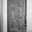 Interior.
Detail of door with embroidery, first floor landing, W wing.