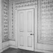 Interior.
Detail of sitting room door and wallpaper, first floor.