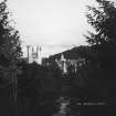 Balmoral Castle.
General view South obscured by trees.
Insc: '504 Balmoral Castle'